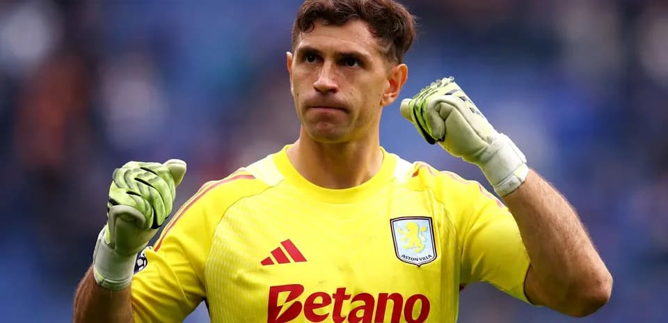 Goalkeeper celebrating with clenched fists in uniform