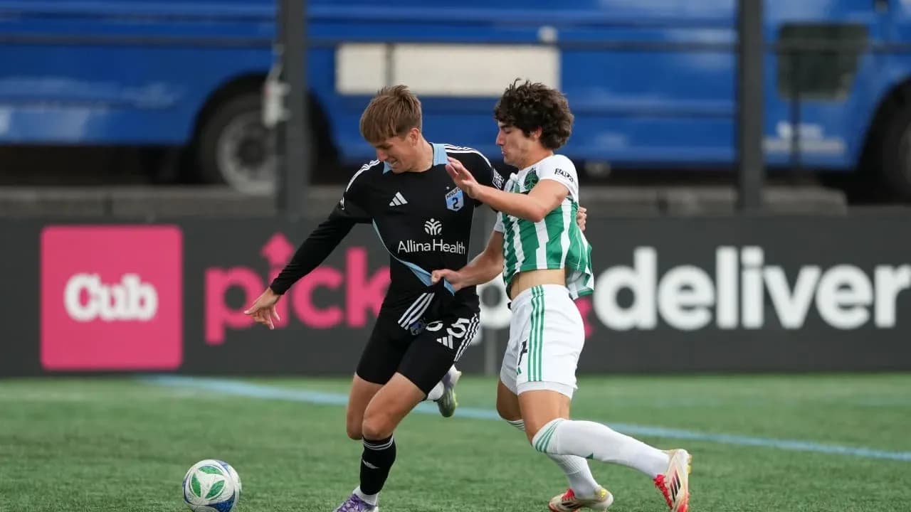 Players competing for the ball during MLS Next Pro match