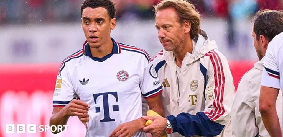 Bayern Munich player receiving assistance from staff