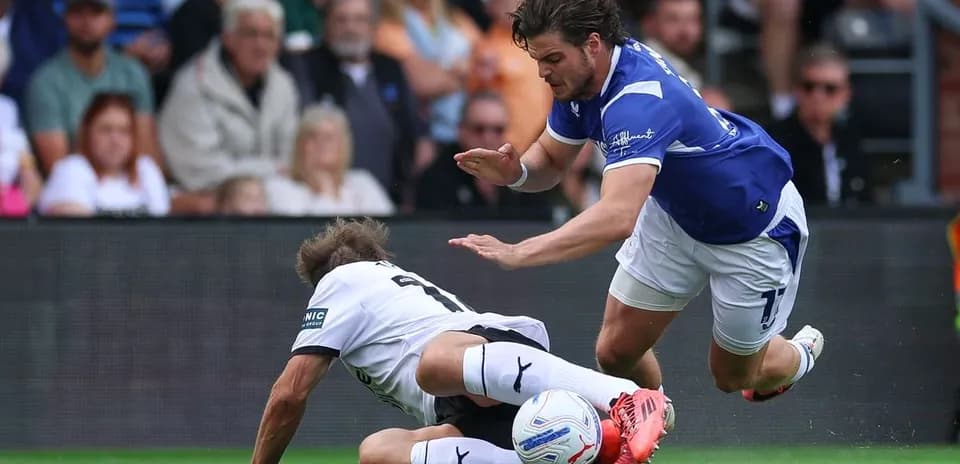 Player tackling opponent on the field during match