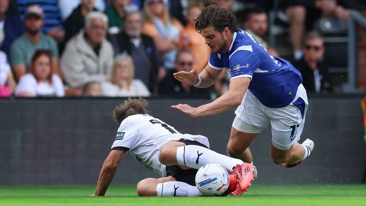 Player tackling opponent on the field during match
