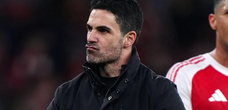 Manager celebrating on the pitch after match