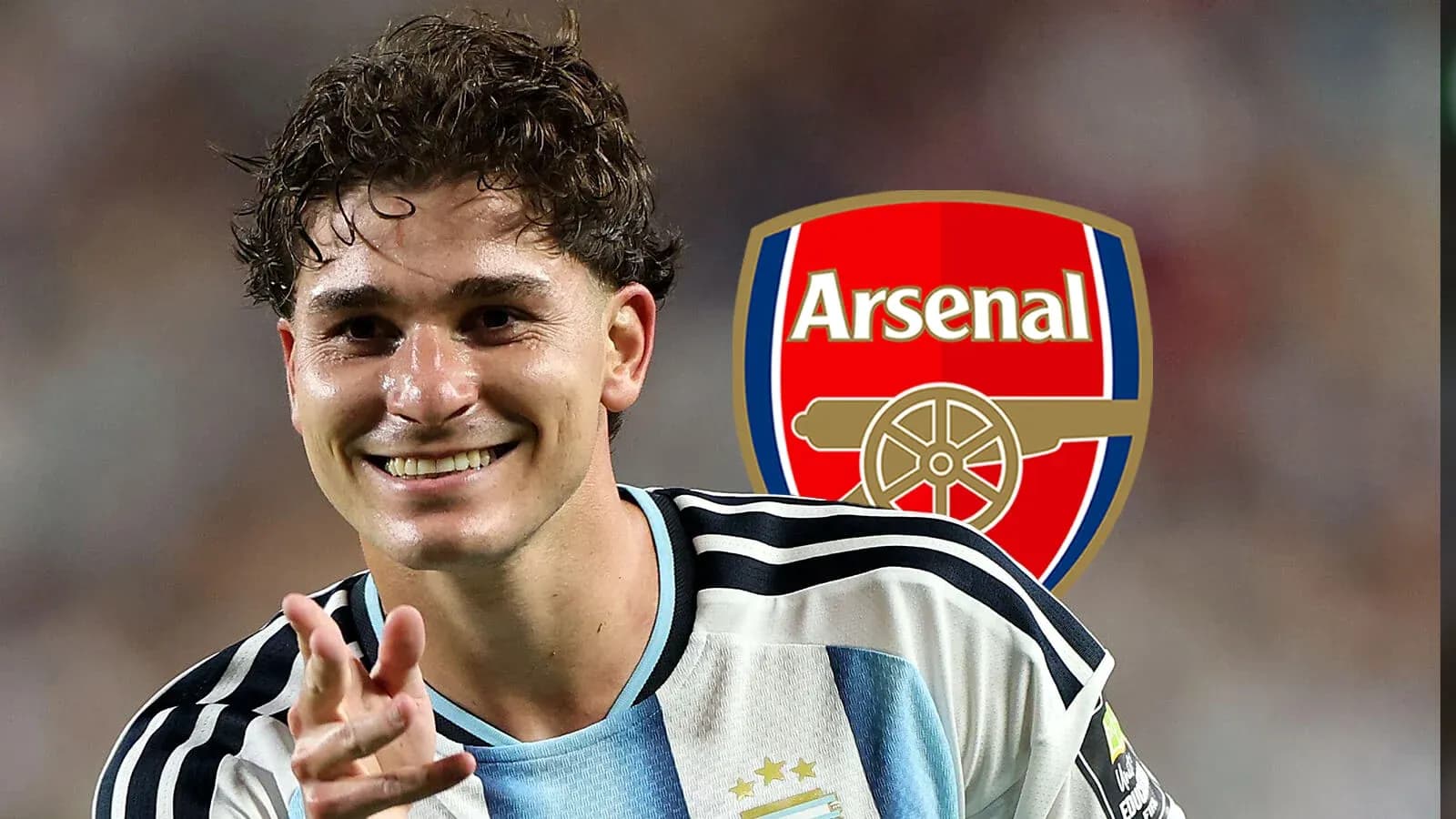 Player celebrating with Arsenal logo in background