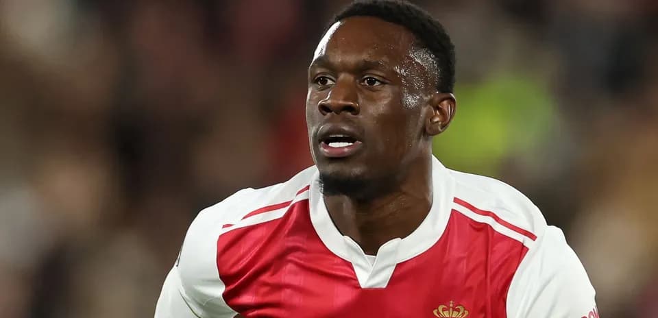 Player in AS Monaco jersey running on the field