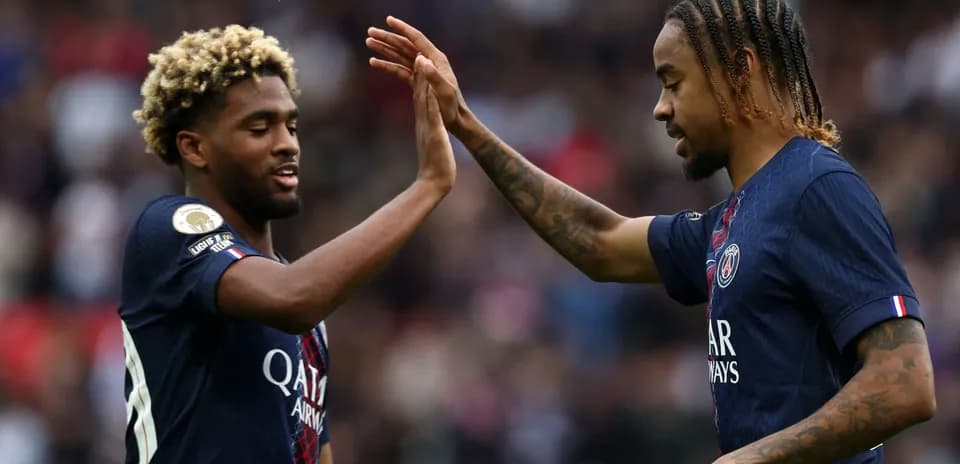Two Paris Saint-Germain players celebrating a goal