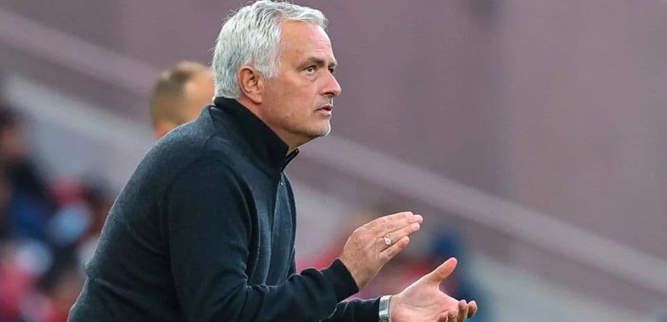 Coach gesturing during a football match