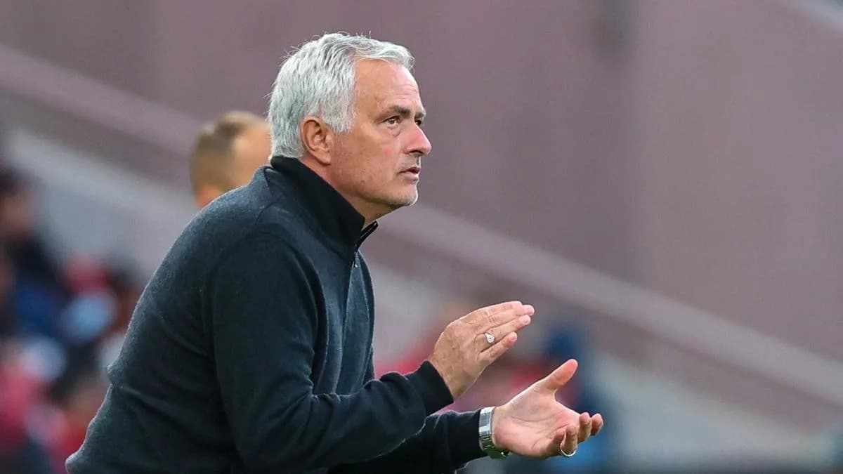 Coach gesturing during a football match