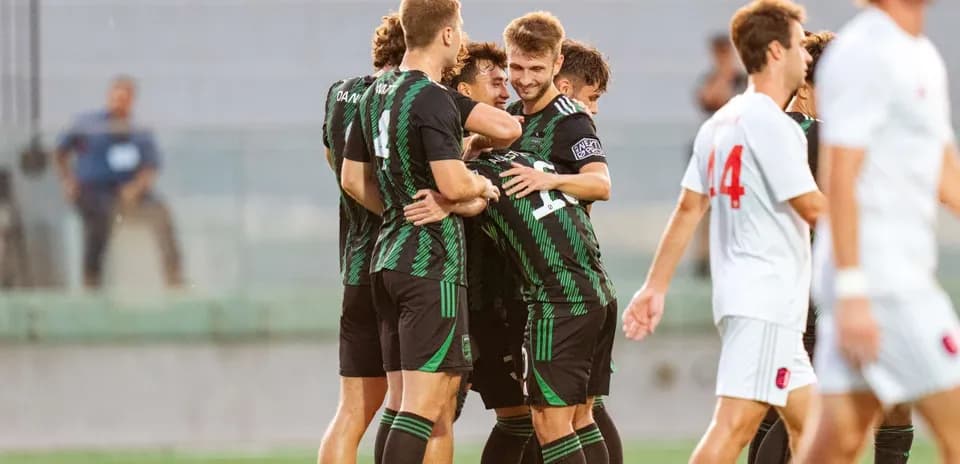 Austin II players celebrating a goal during match