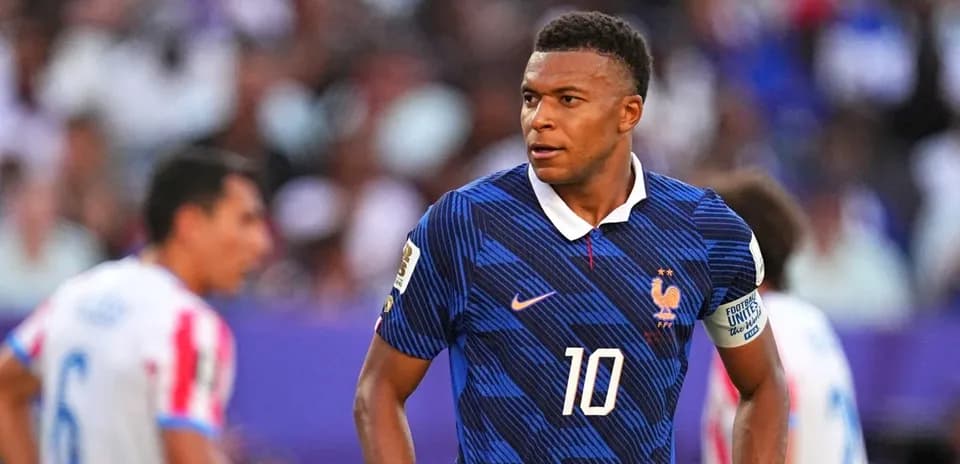 Kylian Mbappé wearing France jersey during match