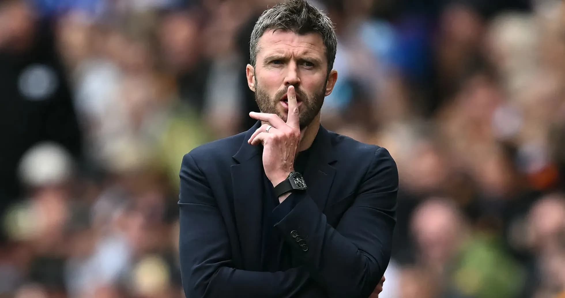 Coach gesturing for silence during match