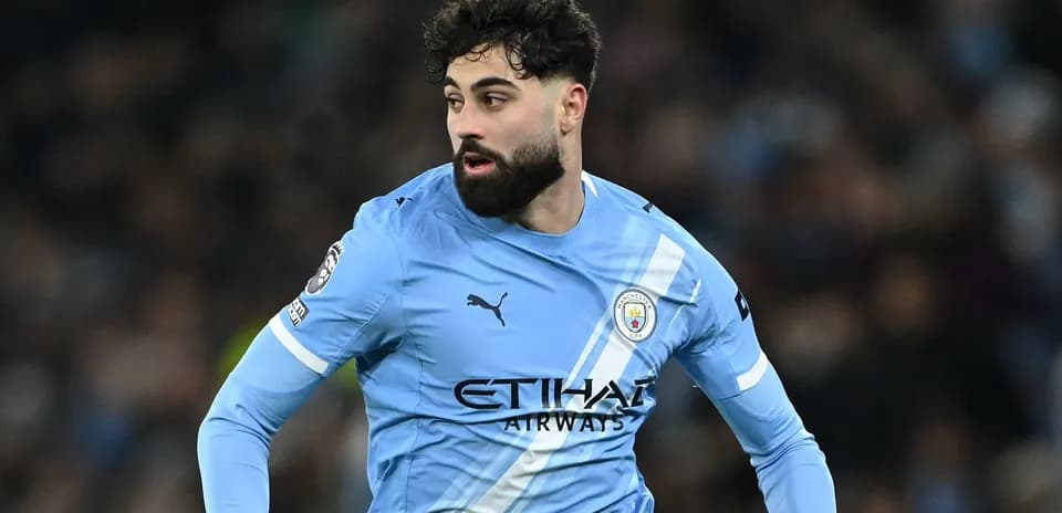 Player in blue Manchester City kit during match