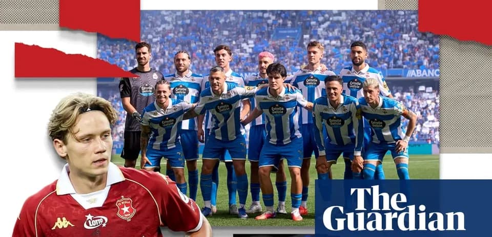 Football team posing for photo in stadium