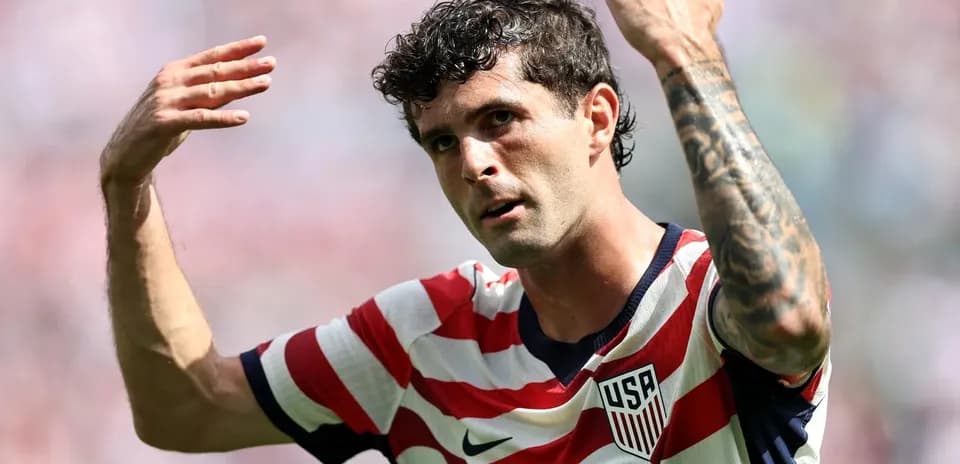 Player gesturing during a match wearing USA jersey