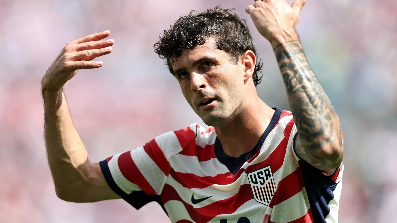 Player gesturing during a match wearing USA jersey