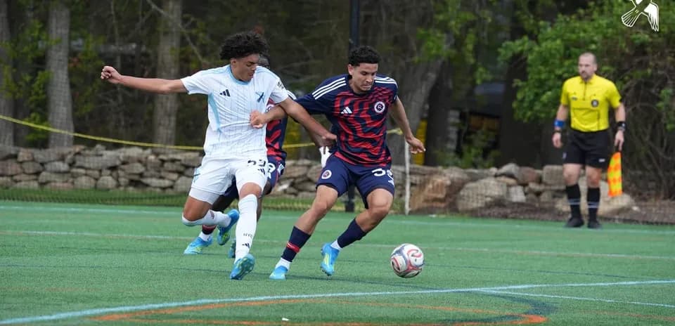 Players competing for the ball during match