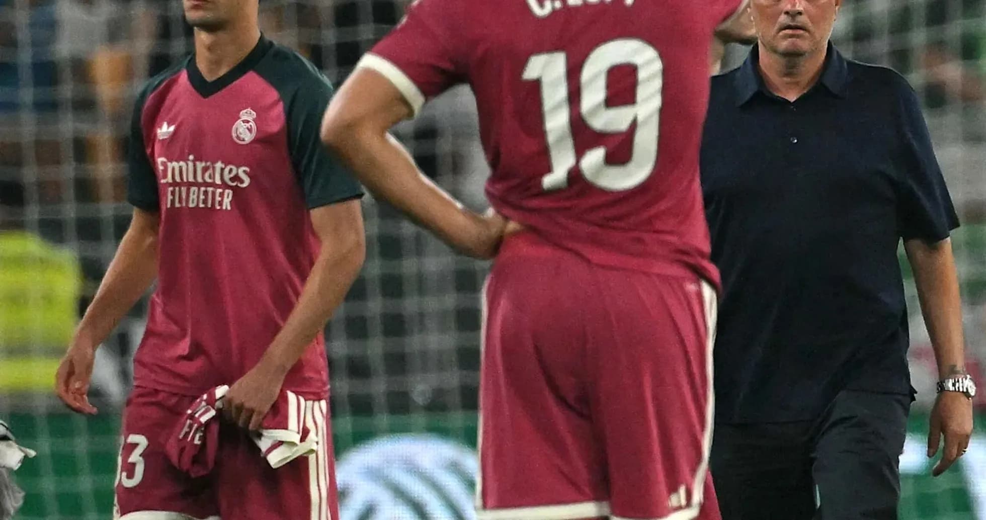 Players and manager on the field after match