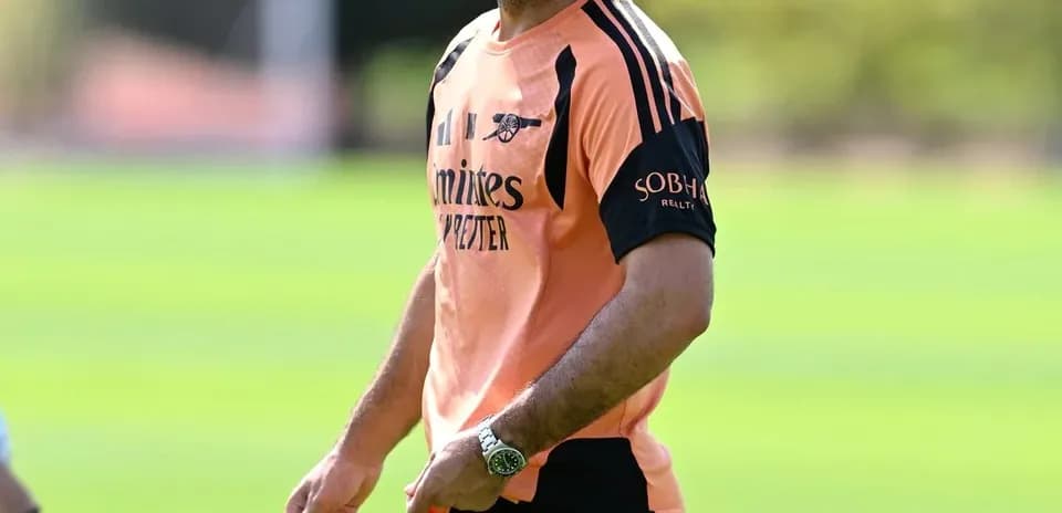Manager smiling during training session at pitch