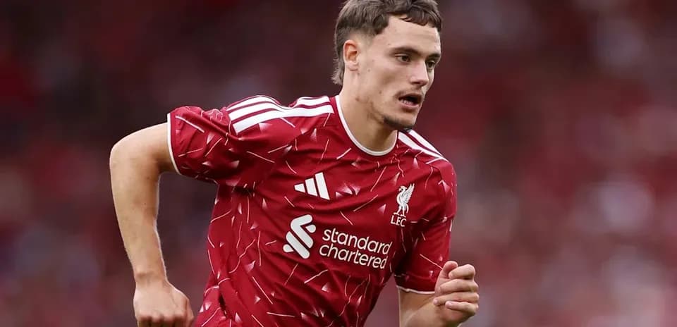 Player running during Liverpool match in red kit