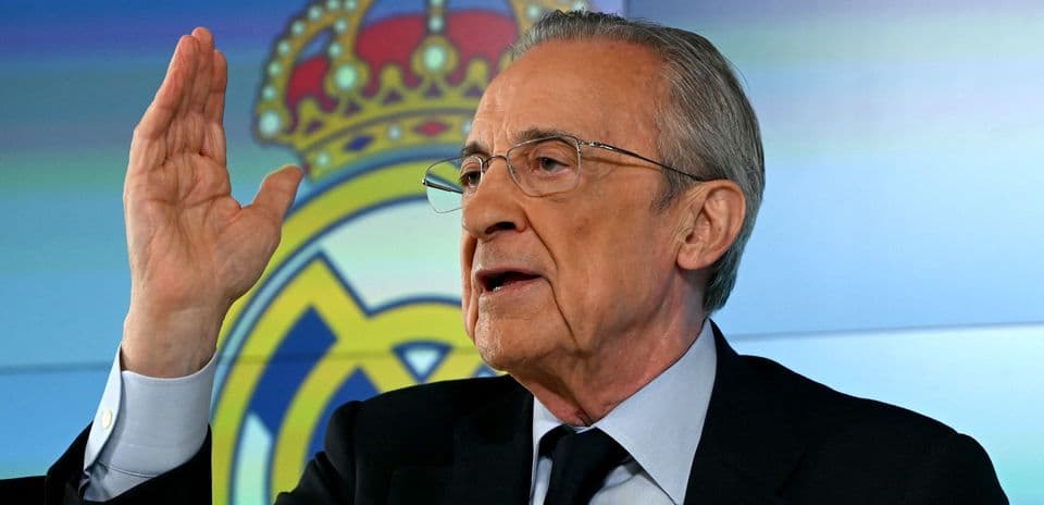 Man gesturing while speaking at press conference