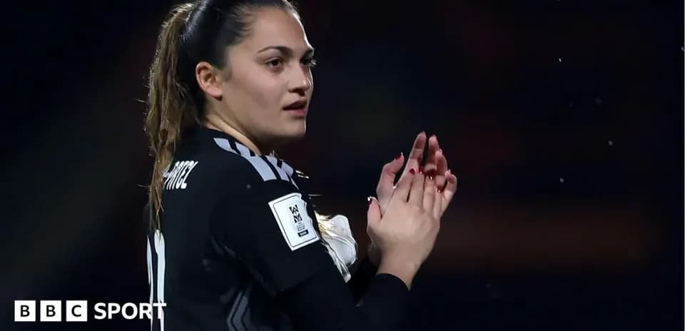 Goalkeeper clapping during match celebration