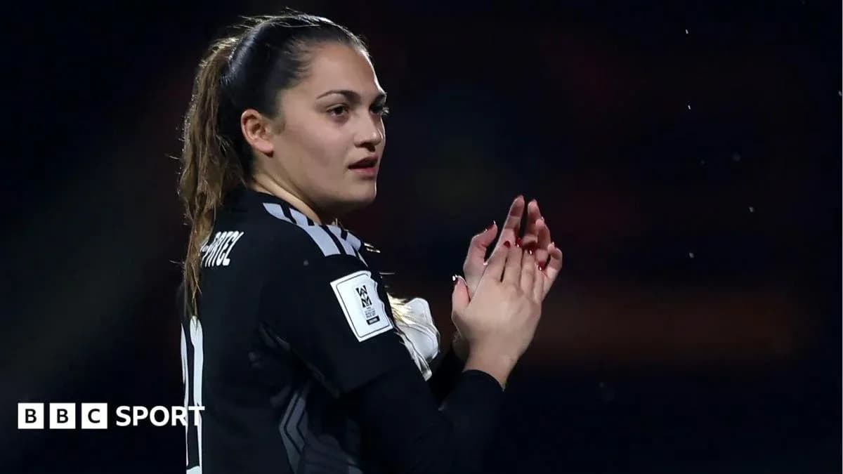 Goalkeeper clapping during match celebration