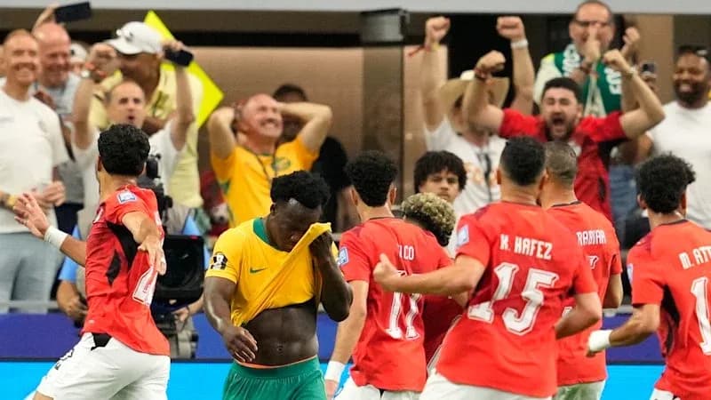 Players celebrating a goal during a match