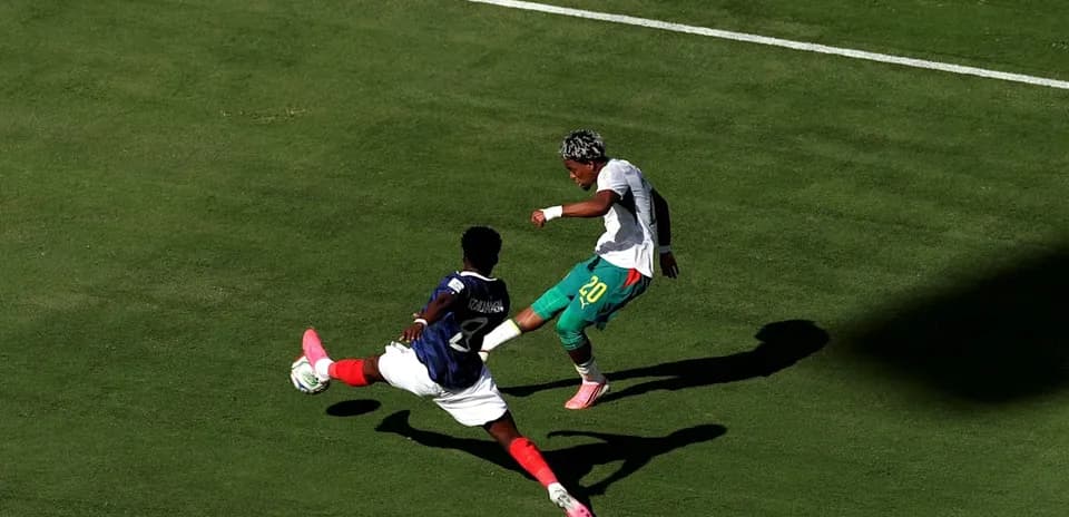 Player attempting to dribble past opponent in match