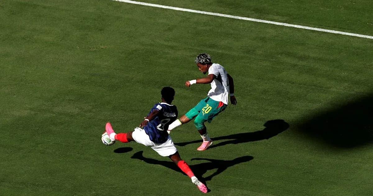 Player attempting to dribble past opponent in match