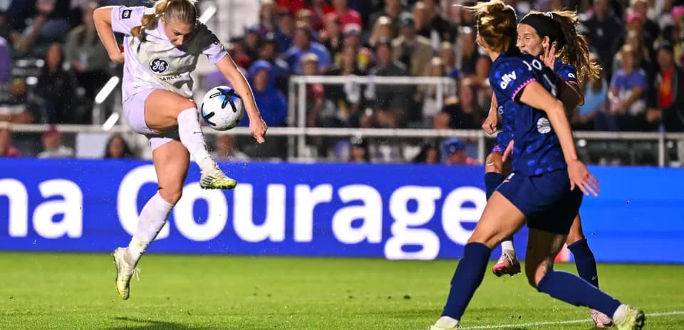Player kicking ball during Racing Louisville match