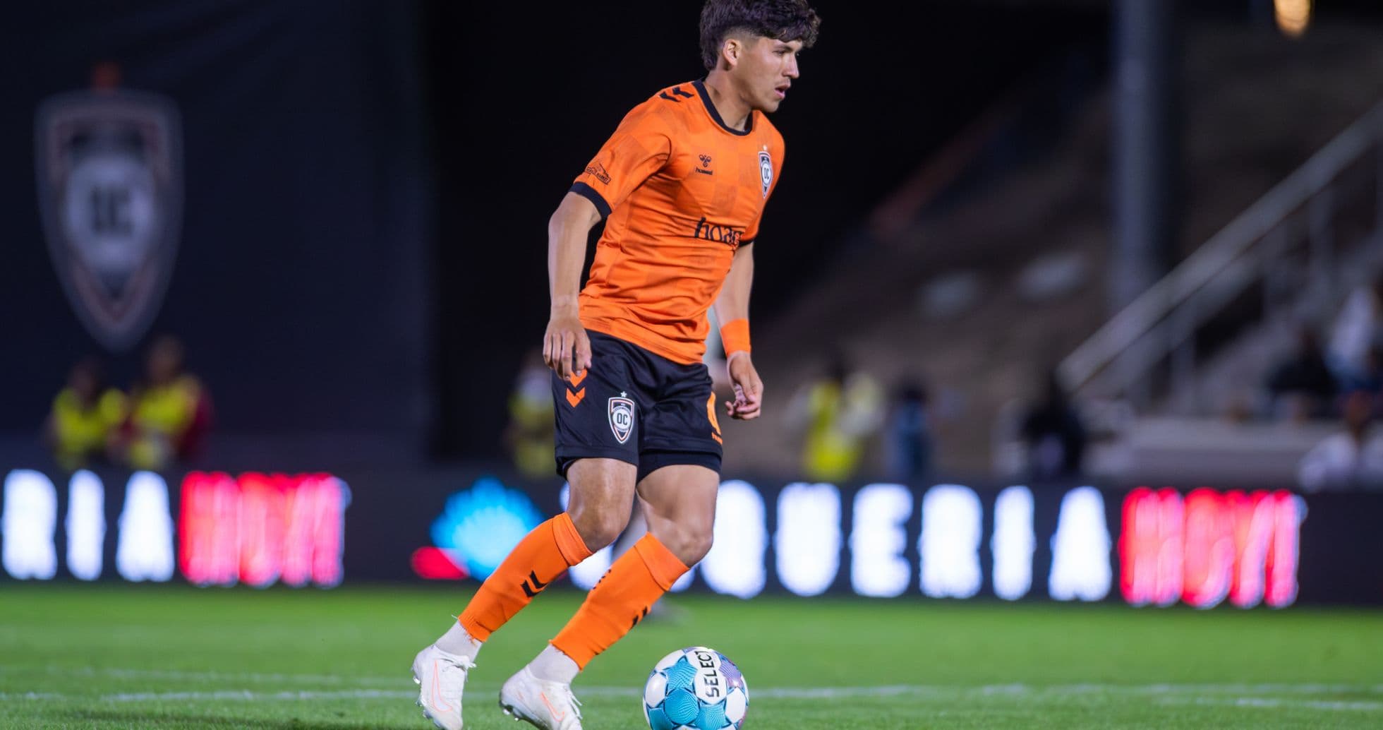 Player dribbling the ball during USL match