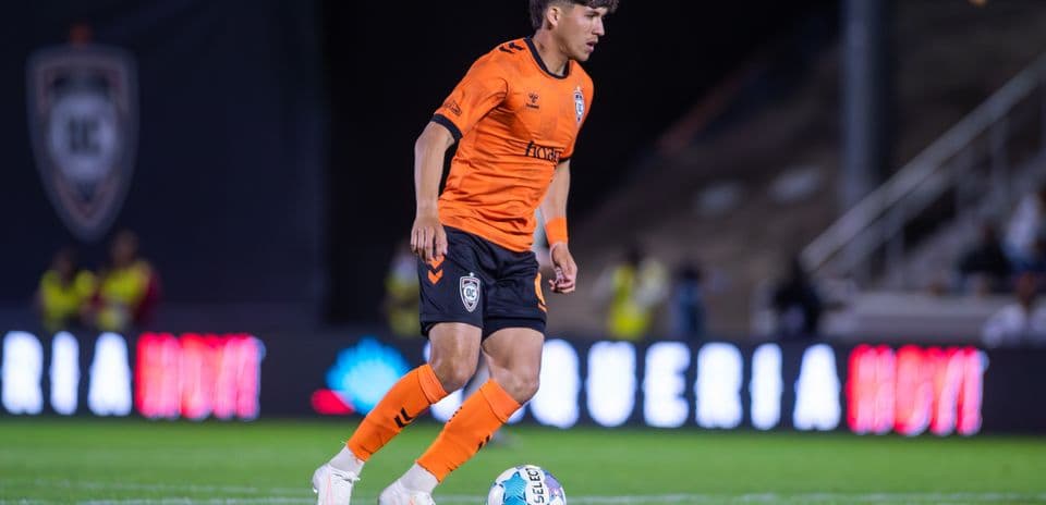 Player dribbling the ball during USL match