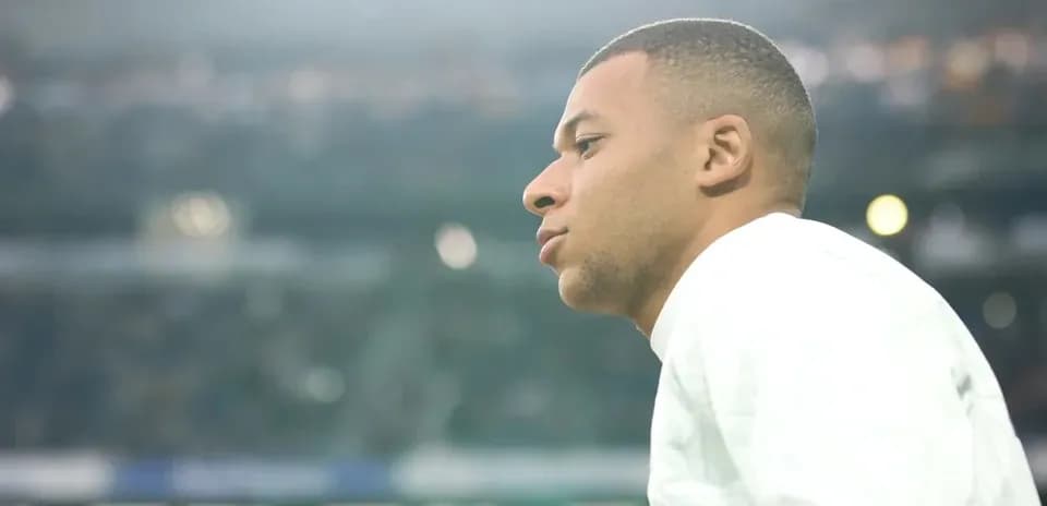 Player observing from the sidelines during match