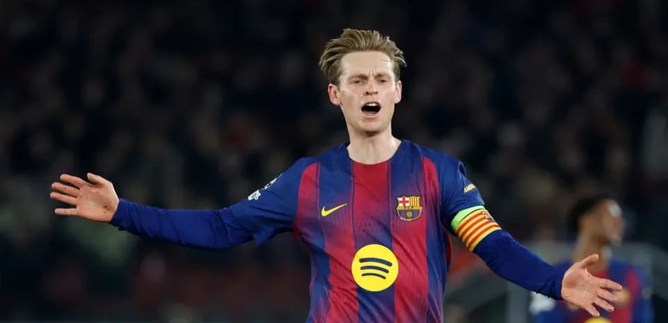 Player gesturing during match wearing Barcelona jersey