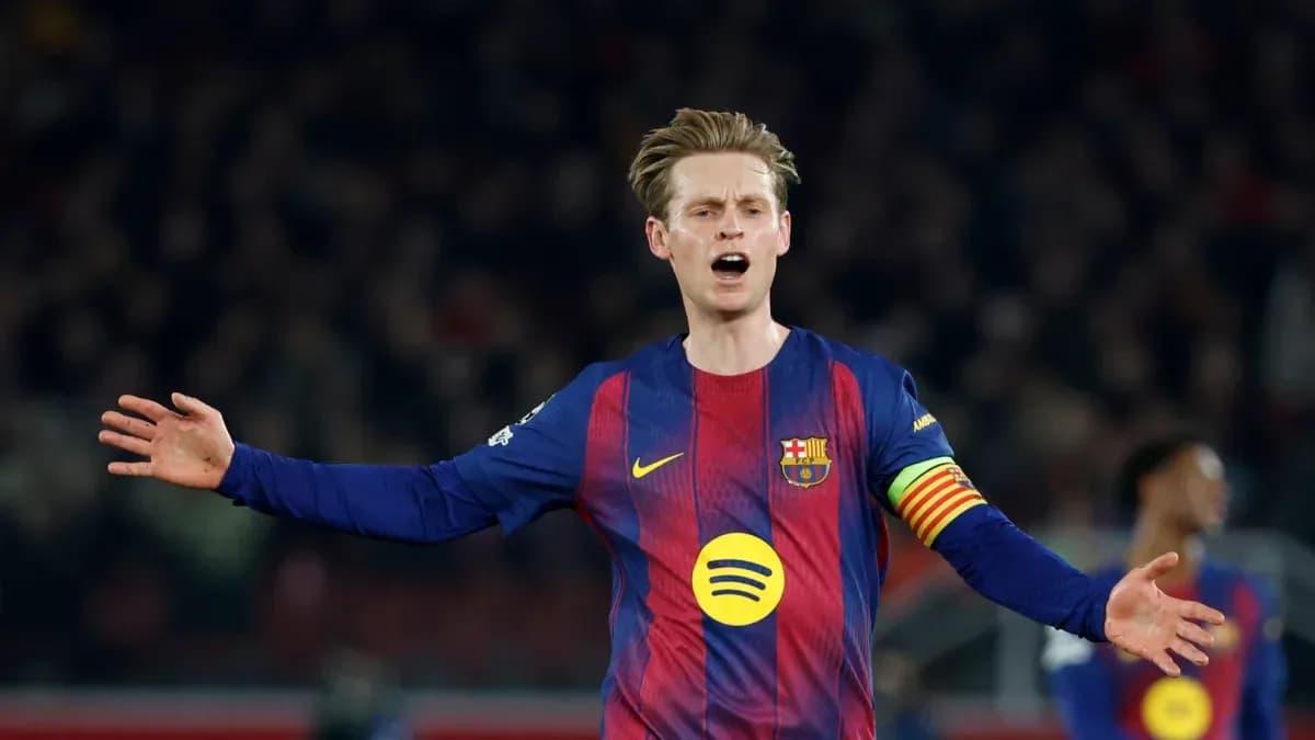Player gesturing during match wearing Barcelona jersey