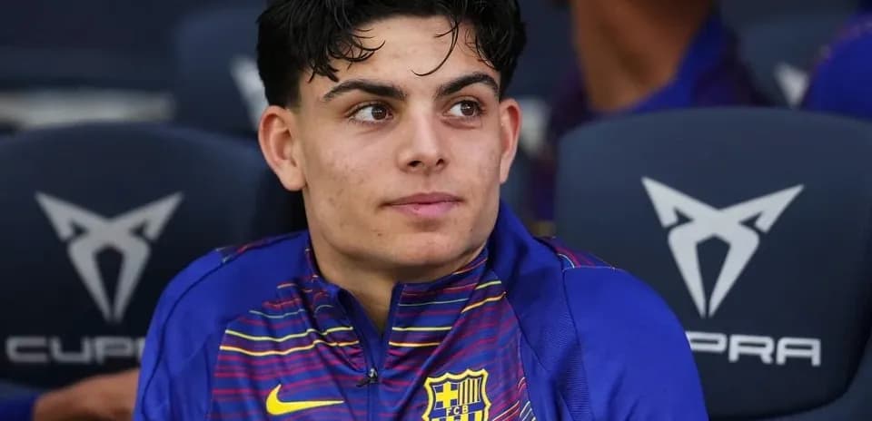 Young player sitting on bench during match