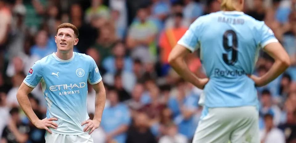 Two Manchester City players on the pitch during match