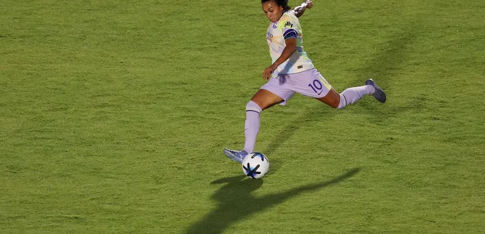 Player striking the ball during NWSL match