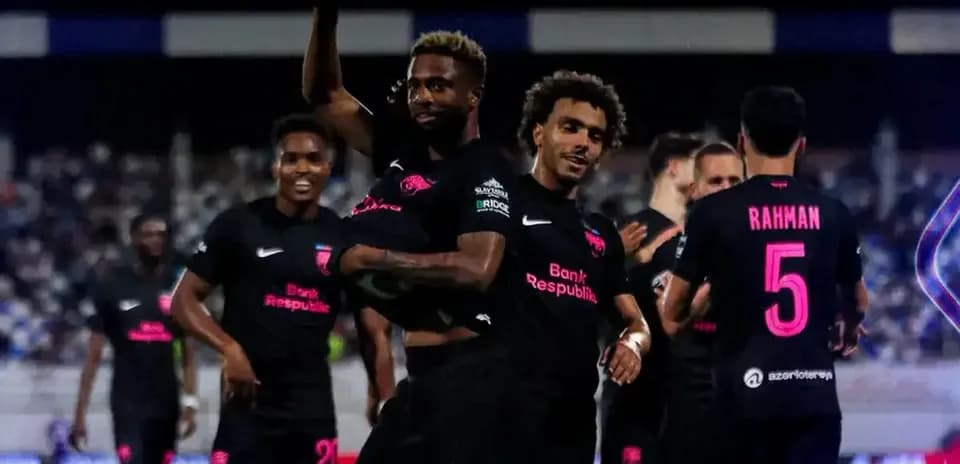 Players celebrating during KuPS vs Sabah FA match