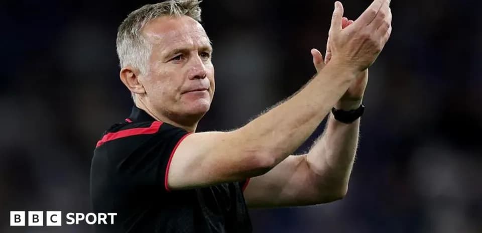 Coach applauding fans after a match