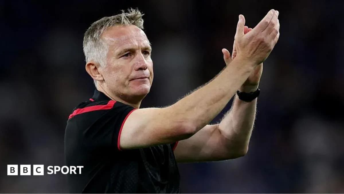 Coach applauding fans after a match
