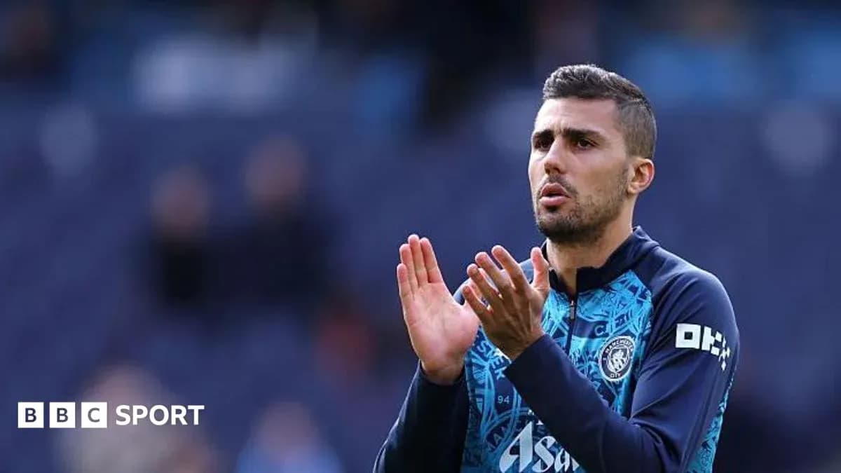 Player applauding fans during match warm-up
