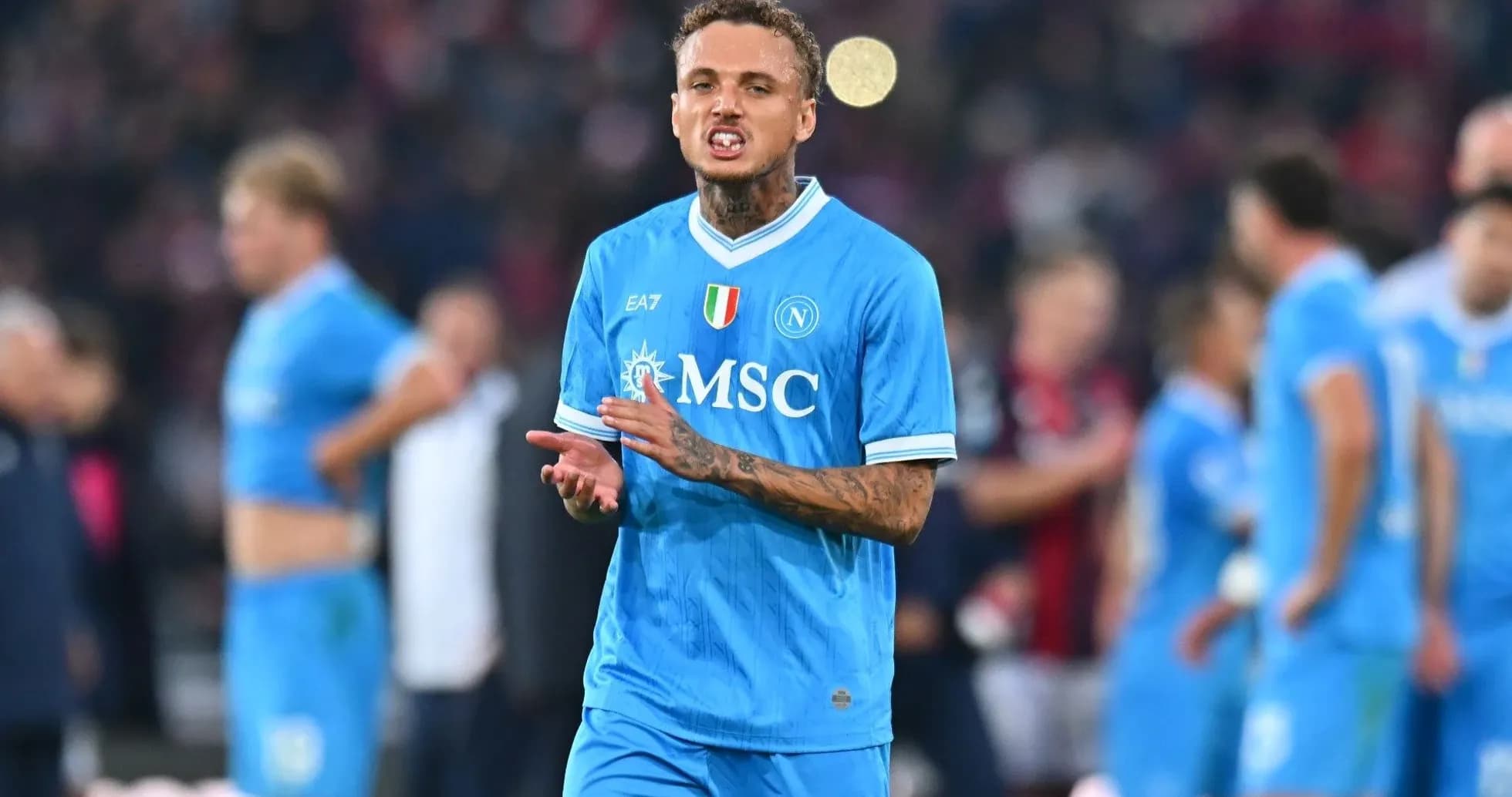 Player in blue Napoli jersey reacting during match
