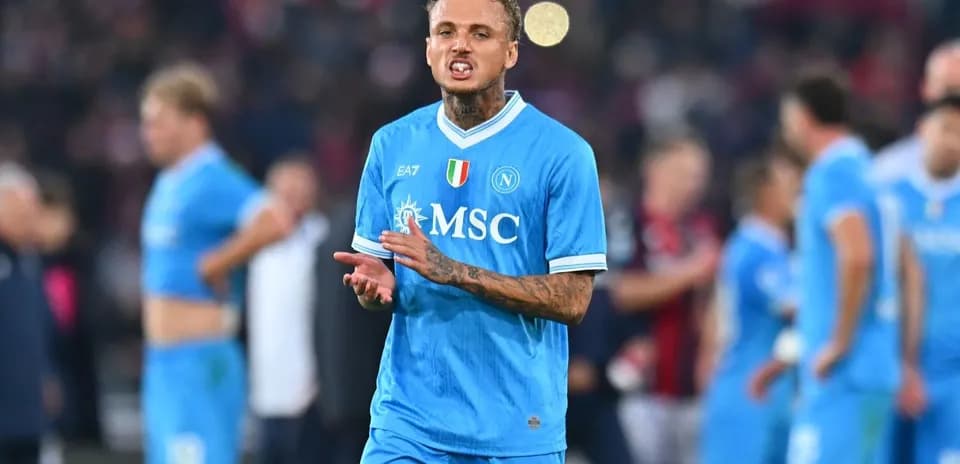 Player in blue Napoli jersey reacting during match