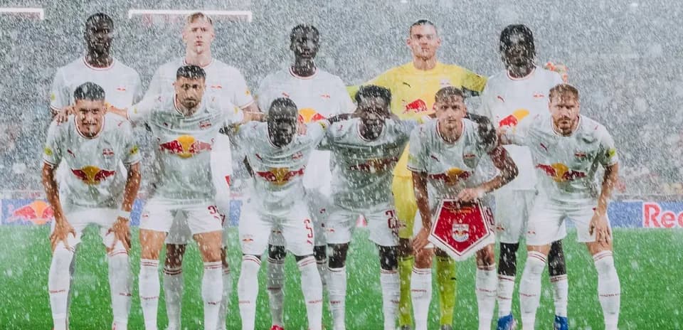 Red Bull Salzburg team posing in rain