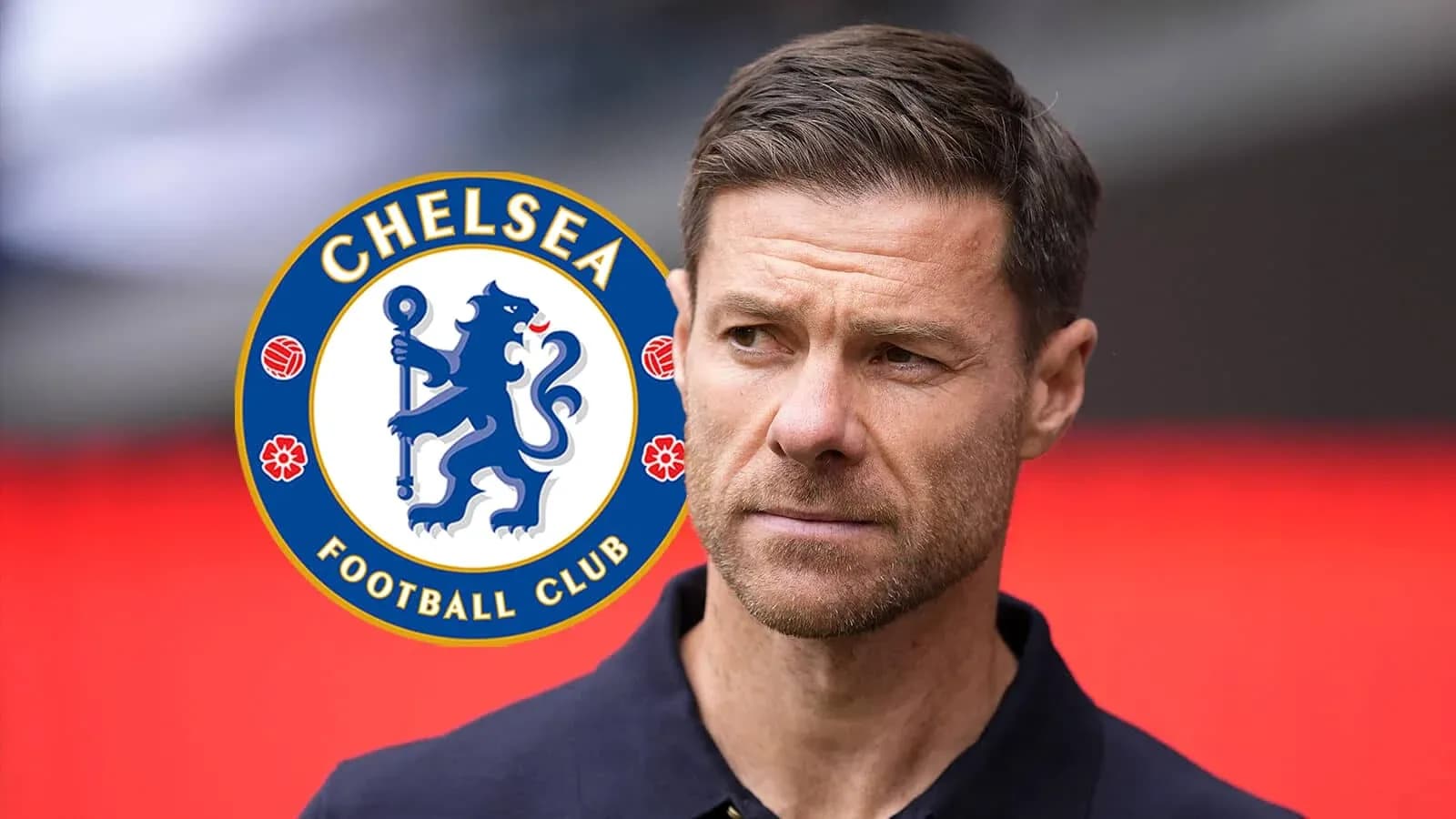 Man in navy shirt near Chelsea FC logo