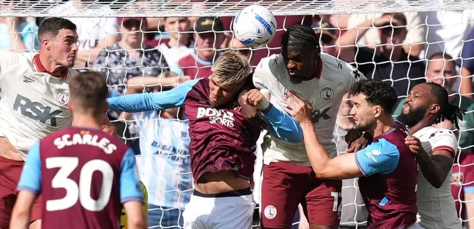 Players battling for the ball near the goal