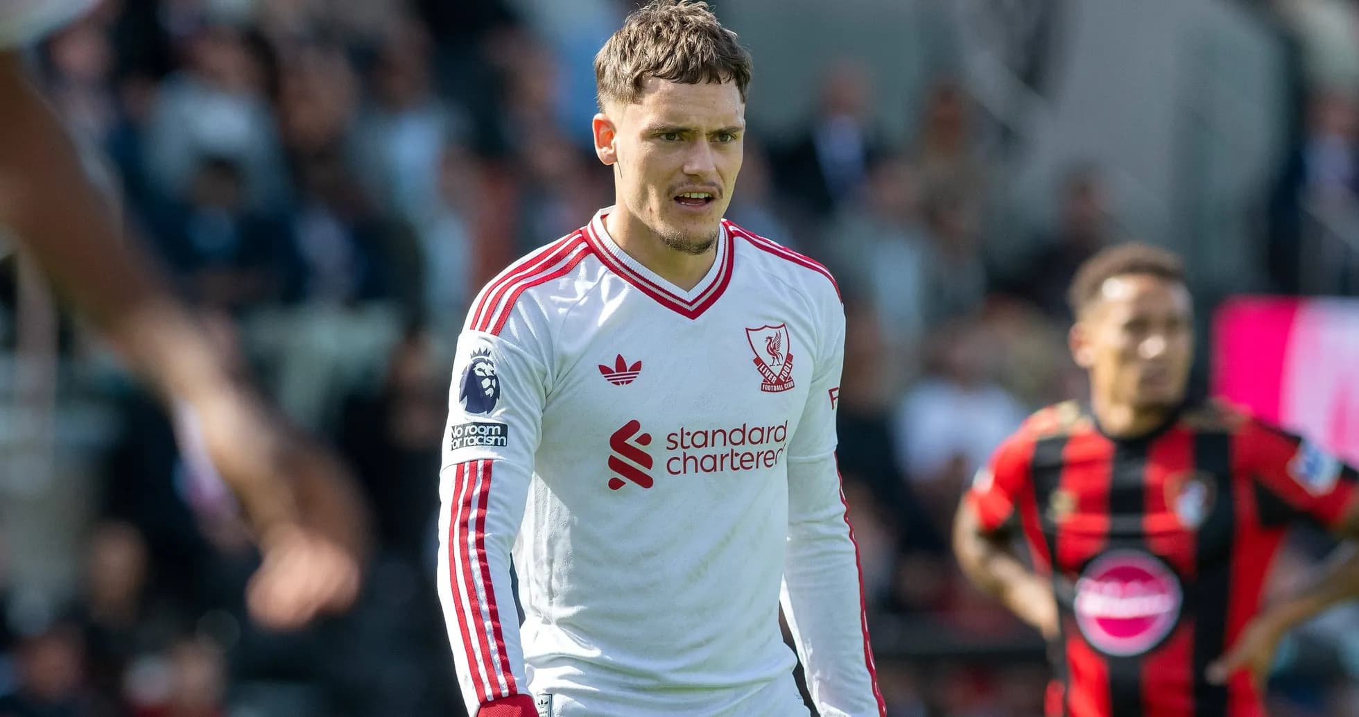Liverpool player in white kit during match