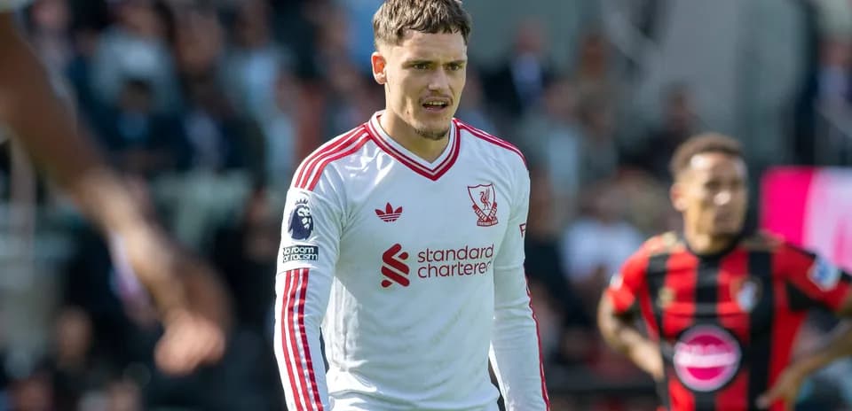Liverpool player in white kit during match