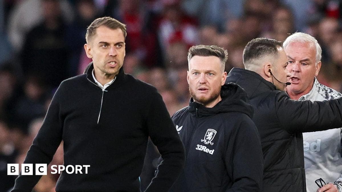 Coaches and staff reacting during a tense moment
