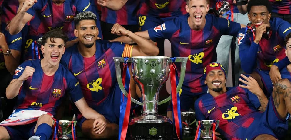 FC Barcelona players celebrating with trophy